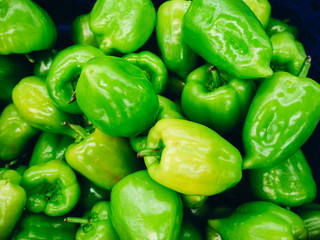 Obraz na płótnie Canvas Some fresh green bell peppers.