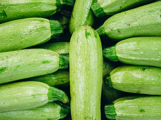 Many fresh zucchini shot from above.