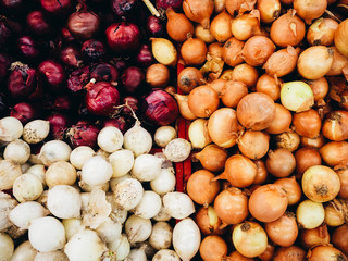 Boxes with red onions in a store, supermarket, market