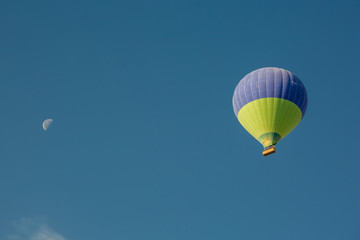 Flying balloons over amazing rock forms in Cappadocia