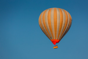 Flying balloons over amazing rock forms in Cappadocia