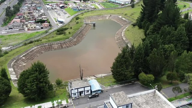 Aerial top view recirculation solid contact clarifier sedimentation tank Water treatment plant, Aerial view of reservoir and water treatment facility on a city