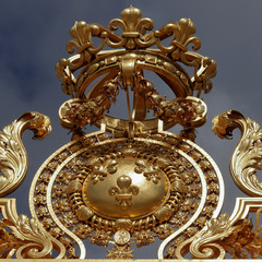 Elements of golden gates decorations at Versailles in Paris, France