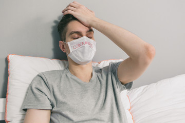 Portrait of a sick man wearing medical mask with coronavirus text at gray background. Coronavirus concept. Protect your health. Pandemic