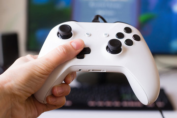 Hand holding game console controller © Alusha