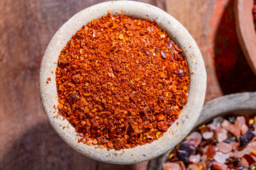 Indian spices collection, dried hot kayen pepper and another spices in clay bowls