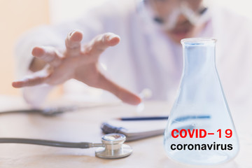 Asian man scientist Chemical research working in lab inject blue liquids with Hold beaker.Covid 19 for stop covid 19 virus covid-19 or corona protected Help protect For world and people stop virus