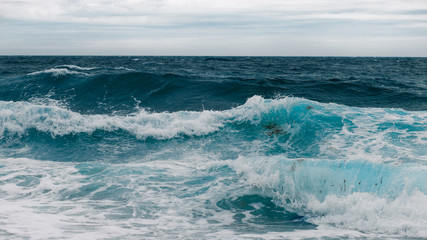 Naklejka na ściany i meble waves on the blue sea