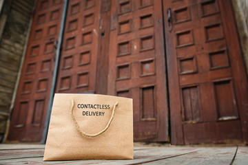 Contactless delivery left at the door during the quarantine. House entrance with delivered craft...