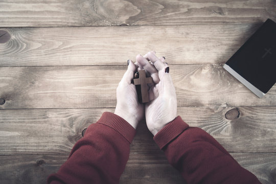 woman hand cross with book
