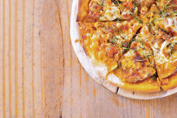 Traditional Italian Pizza on wooden plate.Slice of pizza cheese crust seafood topping sauce  delicious tasty fast food