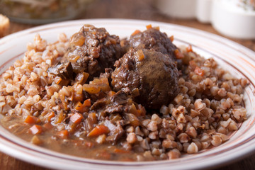   Meatballs in sauce with buckwheat garnish