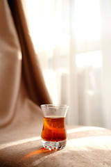 traditional turkish tea cup on fabric background