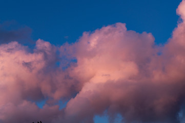 Clouds with sunset light and blue sky