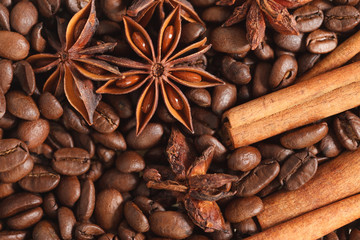 texture spilling coffee beans cinnamon and cloves
