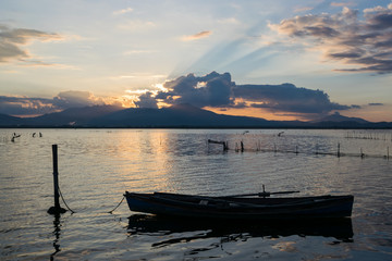 Fototapeta na wymiar A small boat at sunset