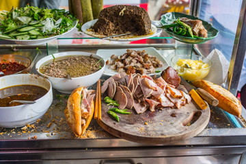 Vietnamese famous pork sandwich- Banh Mi at street food vendor