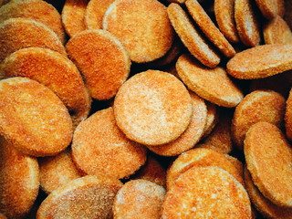 Many frozen cutlets in the supermarket refrigerator. Texture, background.