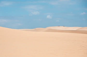 Fototapeta na wymiar White sand dune with blue sky in desert