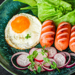 healthy breakfast, fried eggs sausages and vegetables Menu concept. food background. top view copy space for text keto or paleo diets