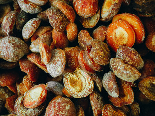 Frozen apricots shot from above. Texture, background.