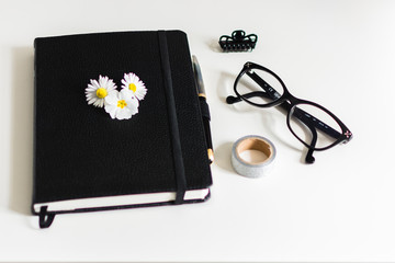 Black Notebook and Flowers