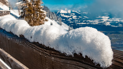 Beautiful winter landscape with snow crystals on a fence at the famous Rossfeldstrasse near Berchtesgaden, Bavaria, Germany