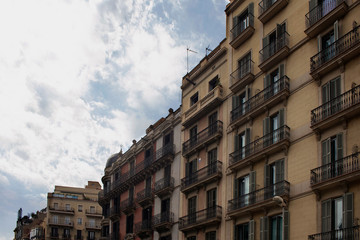 Fototapeta premium View of historical, traditional, typical buildings showing Spanish / Catalan architectural style in Barcelona. It is a summer day.