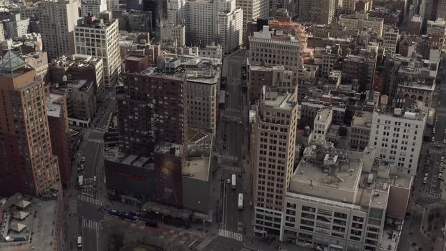 Aerial footage of new york city streets and building with low traffic during pandemic 
