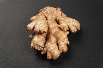 Ginger root on a black slate Board.