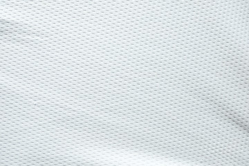 Plakat Selective focus, White mesh fabric background. cloth sport wear texture for exercise. light weight, good air flow, cool and easy to dry from sweat. abstract wallpaper with copy space for text.
