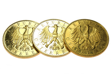 Austrian 100 Schilling gold coins isolated on white background
