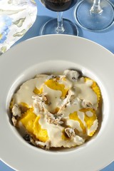 Mezzaluna stuffed with brie cheese, apricot and mint with shimeji cream