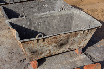 Clean concrete bucket for receiving concrete at a construction site. Concrete bucket for wet...