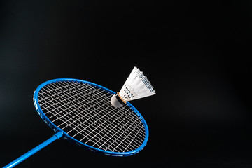 Badminton sport equipment on dark black background close up