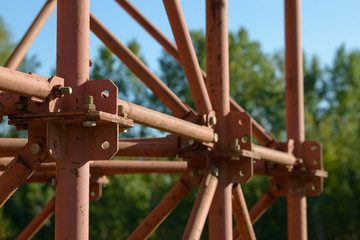Scaffolding Elements Construction. Metal scaffolding tubes and bars. Construction site details. Bridge support. Industrial background.