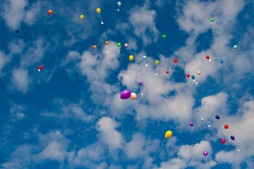 Colorful ballons flying into the air