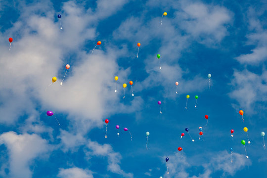 Colorful ballons flying into the air
