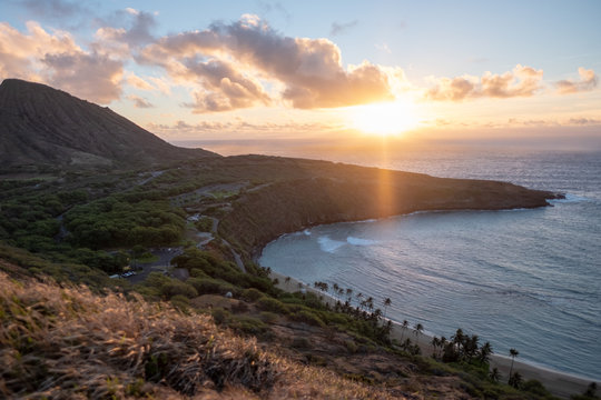 Hanama Bay sunrise - orange - golden hour - over pacific ocean