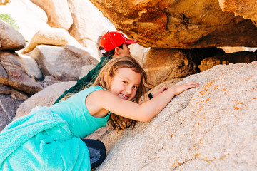 Brother and Sister Exploring Desert Landscape