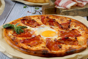 Carbonara pizza with egg and bacon