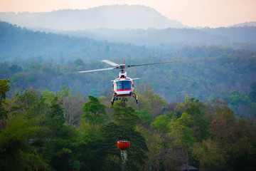 The helicopter is drawing water from the reservoir and will be watered to extinguish the burning...