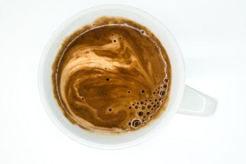 white coffee mug with hot instant coffee foam top view