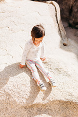 Obraz na płótnie Canvas Toddler Girl Exploring Desert Landscape