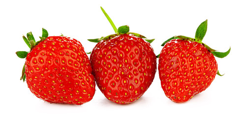 Strawberries with leaves isolated on a white background.