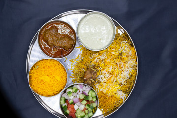Biryani rice with mint and chicken plate top view
