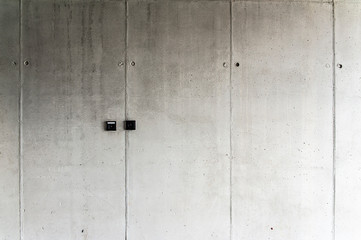 Fototapeta na wymiar Black electric sockets on the concrete wall
