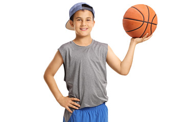 Boy in sportswear holding a basketball