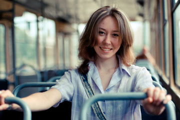 girl sitting on an empty tram