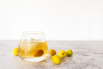 a glass of Japanese plum wine 'Umeshu'